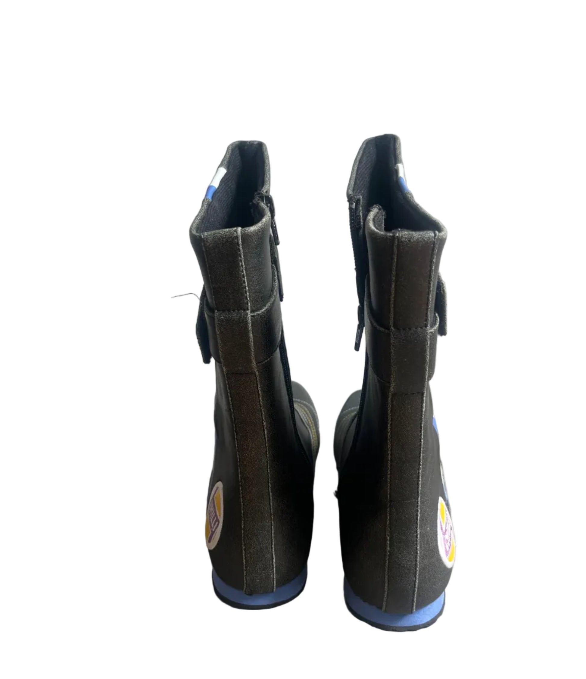 Pair of black boots with blue soles on a white background